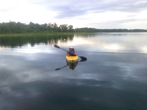 Eve on the water in a kayak